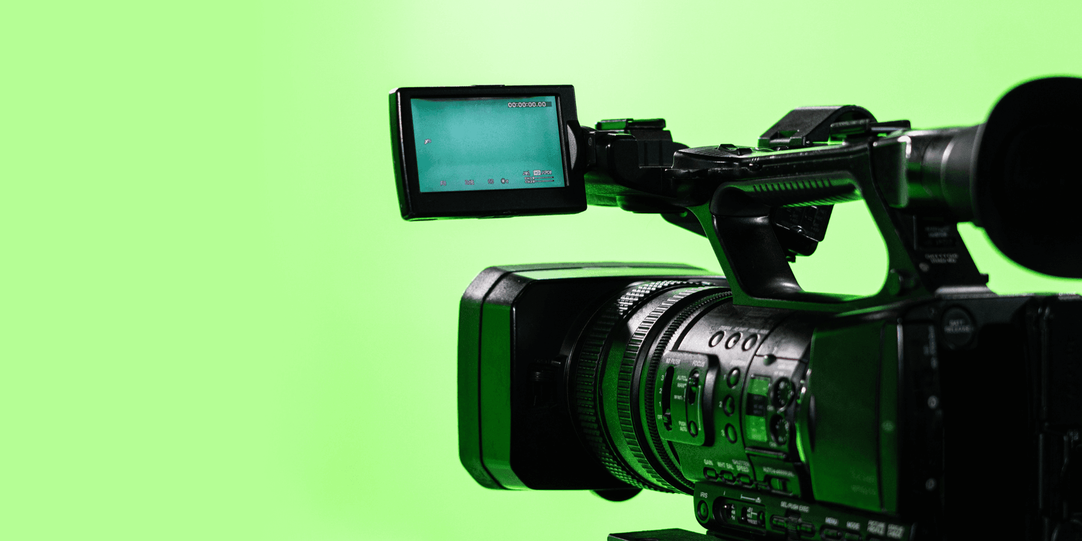 TV camera in professional chroma studio, green screen backdrop